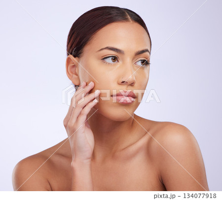 Face, skincare or natural makeup on woman in studio isolated on white background for aesthetic. Facial routine, beauty grooming or hand of girl model relaxing with glow, self love or luxury cosmetics Face, skincare or natural makeup on woman in studio isolated on white background for aesthetic. Facial routine, beauty grooming or hand of girl model relaxing with glow, self love or luxury cosmetics 134077918