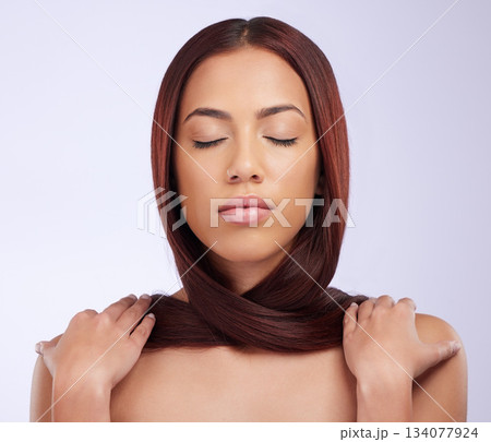 Hair care, woman and calm in a studio with beauty and haircut growth from salon styling. Isolated, gray background and young female model with healthy cosmetics and shampoo treatment results Hair care, woman and calm in a studio with beauty and haircut growth from salon styling. Isolated, gray background and young female model with healthy cosmetics and shampoo treatment results 134077924