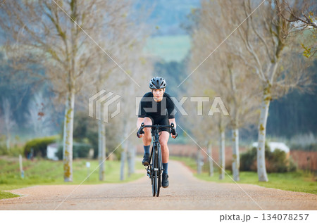 Cycling, fitness and cardio with woman in park for training, workout and health. Exercise, travel and freedom with female cyclist riding on bike in nature for adventure, journey and transport Cycling, fitness and cardio with woman in park for training, workout and health. Exercise, travel and freedom with female cyclist riding on bike in nature for adventure, journey and transport 134078257
