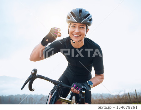 Fitness, celebration and portrait of woman cycling with power fist, success or victory in the countryside. Happy, sports and face of lady cyclist celebrating workout achievement, milestone or winning Fitness, celebration and portrait of woman cycling with power fist, success or victory in the countryside. Happy, sports and face of lady cyclist celebrating workout achievement, milestone or winning 134078261