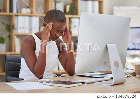 Headache, migraine and pain of woman on computer stress, depression or mental health risk in office for news. Confused, depressed or frustrated African business person with burnout or fatigue online 134078324