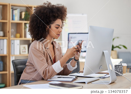 Business, phone or woman on social media to relax online on a break at workplace office desk. Mobile app, typing or biracial girl journalist texting or searching for blogs, news or internet articles Business, phone or woman on social media to relax online on a break at workplace office desk. Mobile app, typing or biracial girl journalist texting or searching for blogs, news or internet articles 134078357