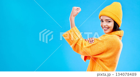 Strong, mockup and a portrait of a woman with muscle isolated on a blue background in a studio. Smile, style and a girl showing fashion for empowerment and confidence on a backdrop with space Strong, mockup and a portrait of a woman with muscle isolated on a blue background in a studio. Smile, style and a girl showing fashion for empowerment and confidence on a backdrop with space 134078489