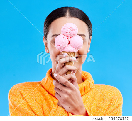 Ice cream, cover and hide with woman in studio for snack, dessert and sweets. Diet, summer and junk food with female and frozen gelato isolated on blue background for sugar, nutrition and mockup 134078537