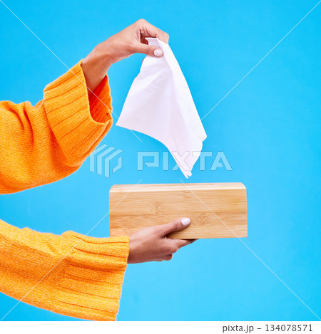 Tissue, box and hands of woman on blue background for sinus, sickness and flu on blue background. Healthcare mockup, paper and girl with wipe, napkin and handkerchief for hygiene, allergy and sneeze 134078571