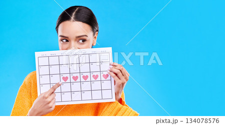 Calendar, period and woman on blue background with heart for schedule, planning and menstruation in studio. Reminder mockup, monthly and eyes of girl with poster for date, weekly planner and cycle 134078576