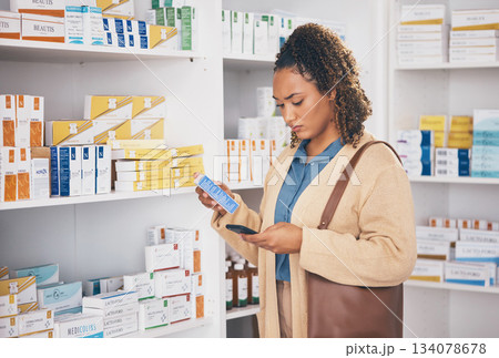 Pharmacy, medication and woman customer shopping for healthcare products or drugs in a drugstore. Dispensary, medical and female doing research with a phone on medicine in retail pharmaceutical shop. Pharmacy, medication and woman customer shopping for healthcare products or drugs in a drugstore. Dispensary, medical and female doing research with a phone on medicine in retail pharmaceutical shop. 134078678