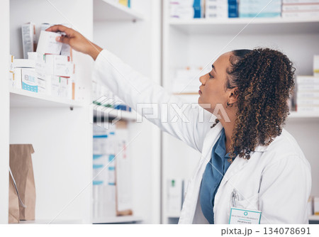 Woman, drugs and pharmacist in pharmacy with supplements, healthcare and medicine in drug store. Vitamins, pills and female search for prescription medication with stock and pharmaceutical industry 134078691