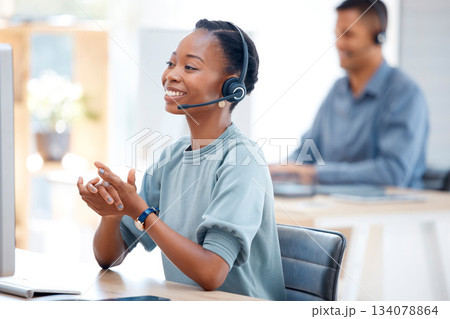 Call center, smile or friendly black woman in communication at telecom customer services office. Microphone, crm or happy African sales agent consulting, speaking or talking in tech support help desk 134078864
