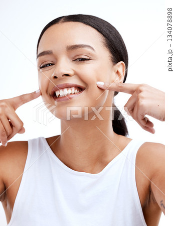 Happy, beautiful and portrait of a woman for beauty isolated on a white background in a studio. Smile, skincare and face of a young model looking confident about clear complexion and smooth skin Happy, beautiful and portrait of a woman for beauty isolated on a white background in a studio. Smile, skincare and face of a young model looking confident about clear complexion and smooth skin 134078898