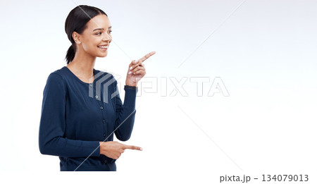Happy studio woman, mockup and pointing at sales promotion, advertising copy space or discount deal mock up. Commercial brand offer, presentation or female marketing gesture on white background Happy studio woman, mockup and pointing at sales promotion, advertising copy space or discount deal mock up. Commercial brand offer, presentation or female marketing gesture on white background 134079013