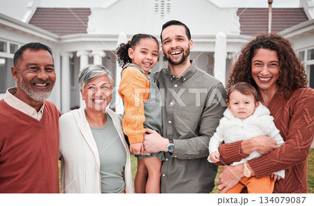 Family, generations and happy people in portrait outdoor, grandparents and parents with children on lawn at home. Men, women and kids, love and care in relationship with smile and happiness at house 134079087