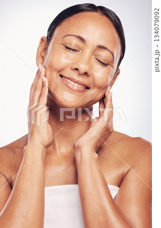 Happy, old woman and face, antiaging skincare with beauty and dermatology, natural cosmetics isolated on studio background. Female eyes closed, satisfaction and wellness with cosmetic care and glow 134079092