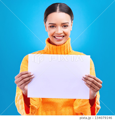 Smile, mockup and poster with portrait of woman in studio for idea, branding and announcement. Promotion, space and paper with female and sign on blue background for news, logo and advertising Smile, mockup and poster with portrait of woman in studio for idea, branding and announcement. Promotion, space and paper with female and sign on blue background for news, logo and advertising 134079146