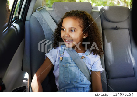 Road trip, girl child and happy in car backseat for travel, journey and drive, happy and relax. Smile, kid and little passenger enjoying drive in vehicle for adventure, vacation or weekend traveling Road trip, girl child and happy in car backseat for travel, journey and drive, happy and relax. Smile, kid and little passenger enjoying drive in vehicle for adventure, vacation or weekend traveling 134079154