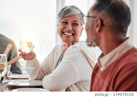 Happy, smile and couple at lunch in family home, drinking wine and laughing at jokes. Conversation, together and a man and woman speaking with a drink during a dinner with friends in a house 134079158