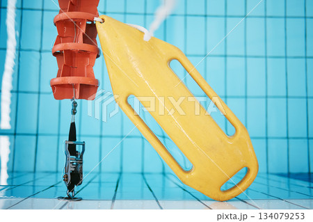 Above, water and a buoy in a pool for a lifeguard, life saving and safety. Board, summer and equipment for protection, security and danger while swimming, rescuing and protecting from drowning 134079253