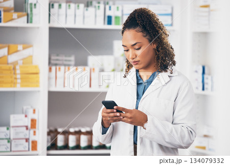 Pharmacist woman, smartphone and texting in store for contact, email communication or reading chat. Pharmacy, female and phone for social media app, typing and medical news on internet in workplace Pharmacist woman, smartphone and texting in store for contact, email communication or reading chat. Pharmacy, female and phone for social media app, typing and medical news on internet in workplace 134079332