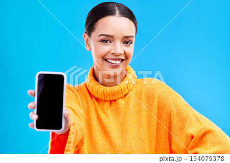 Phone, mockup and smile with portrait of woman in studio for website, technology and social media. Networking, internet and connection with female on blue background for app, announcement and search 134079378