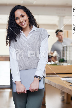 Happy, office and portrait of a woman at work for business, administration and executive job. Smile, morning and a corporate employee standing in the workplace with technology working at an agency Happy, office and portrait of a woman at work for business, administration and executive job. Smile, morning and a corporate employee standing in the workplace with technology working at an agency 134079516