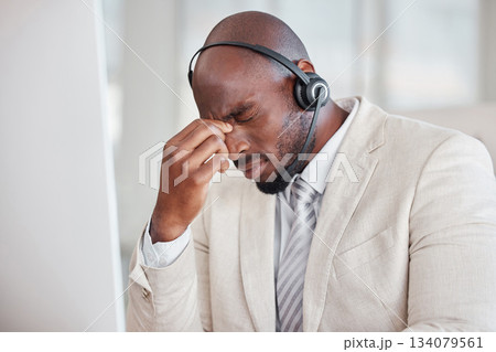 Tired call center man with headache, fatigue and pain on computer customer support, telecom working or virtual help desk. Burnout agent, stress consultant or african person with migraine at office Tired call center man with headache, fatigue and pain on computer customer support, telecom working or virtual help desk. Burnout agent, stress consultant or african person with migraine at office 134079561