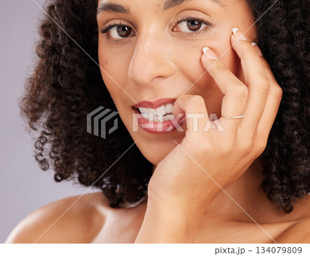 Woman, flirt with face and beauty in portrait, hand and nails with manicure and closeup on studio background. Makeup, natural cosmetics and flirtatious female, skincare and glow with cosmetic care 134079809