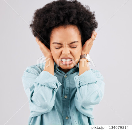 Blocking ears, headache and woman face with stress and burnout feeling frustrated. Mental health, stressed and anger problem from female with anxiety and pain in isolated studio with grey background Blocking ears, headache and woman face with stress and burnout feeling frustrated. Mental health, stressed and anger problem from female with anxiety and pain in isolated studio with grey background 134079814