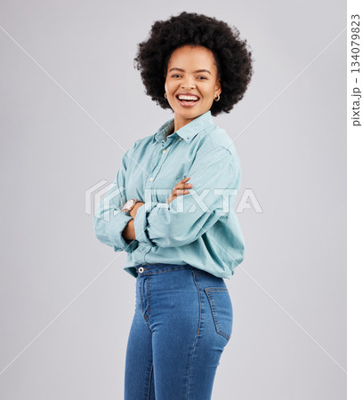 Crossed arms, happy and portrait of black woman in studio with pride, confidence and excited smile. Fashion, happiness mockup and girl with positive mindset, cosmetics and beauty on white background Crossed arms, happy and portrait of black woman in studio with pride, confidence and excited smile. Fashion, happiness mockup and girl with positive mindset, cosmetics and beauty on white background 134079823