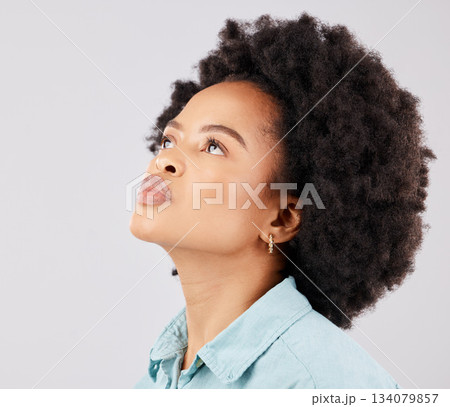 Black woman, afro and thinking in studio with vision, ideas or looking up by white background. Girl, young model and student with idea, brainstorming or mindset for focus, fashion or calm by backdrop 134079857