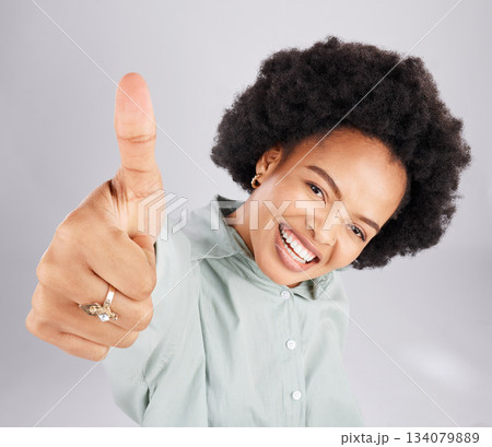 Portrait, thumbs up and black woman top view in studio isolated on a white background. Success, happiness and person with hand gesture or emoji for winning, approval or agreement, like or thank you. 134079889