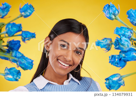 Portrait, love and blue roses with a woman on a yellow background in studio for valentines day. Face, flowers or smile and a happy female posing with plants for anniversary, romance or celebration Portrait, love and blue roses with a woman on a yellow background in studio for valentines day. Face, flowers or smile and a happy female posing with plants for anniversary, romance or celebration 134079931