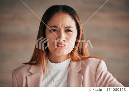 Portrait, frown and business woman in office confused, unsure or unhappy on wall background. Face, sad and angry corporate employee, doubt and emoji expression, overwhelmed and wondering at new job Portrait, frown and business woman in office confused, unsure or unhappy on wall background. Face, sad and angry corporate employee, doubt and emoji expression, overwhelmed and wondering at new job 134080168
