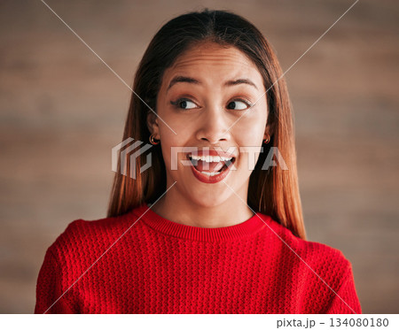 Surprise, excited and face of woman with smile on wall background for good news, announcement and sale. Red fashion, beauty and happy girl with cosmetics for advertising, marketing and discount 134080180