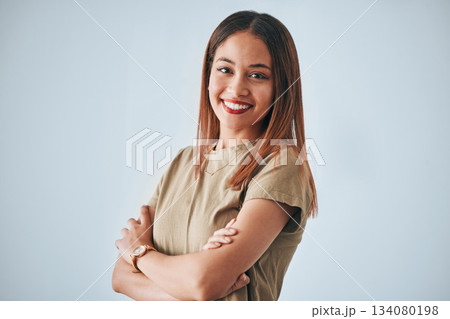 Woman, proud portrait and happiness with arms crossed of a gen z female in a studio with gray background. Isolated, happy and smile from a person feeling motivation, youth and confidence with pride Woman, proud portrait and happiness with arms crossed of a gen z female in a studio with gray background. Isolated, happy and smile from a person feeling motivation, youth and confidence with pride 134080198