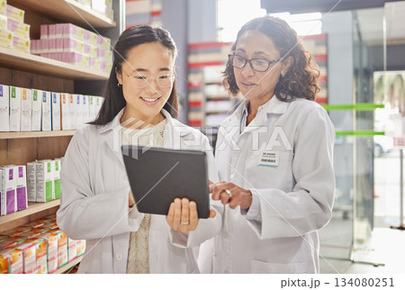 Pharmacist, tablet and teamwork of women in pharmacy for healthcare, stock take or online consultation. Telehealth, collaboration or happy medical professionals in discussion of touchscreen research. Pharmacist, tablet and teamwork of women in pharmacy for healthcare, stock take or online consultation. Telehealth, collaboration or happy medical professionals in discussion of touchscreen research. 134080251