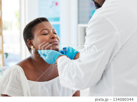 Doctor, patient with sore throat and medical exam, consultation in hospital and healthcare with health insurance. Check facial lymph nodes, black woman with man and medicine professional in clinic Doctor, patient with sore throat and medical exam, consultation in hospital and healthcare with health insurance. Check facial lymph nodes, black woman with man and medicine professional in clinic 134080344