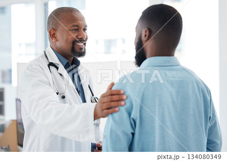 Doctor, black man and touch shoulder of patient for support, comfort and empathy in hospital. Healthcare, consultation and happy medical professional talking, good news or kindness with mature person Doctor, black man and touch shoulder of patient for support, comfort and empathy in hospital. Healthcare, consultation and happy medical professional talking, good news or kindness with mature person 134080349
