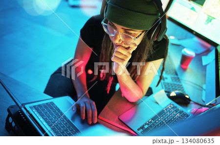 Laptop, woman and hacker thinking with music and programming for cybersecurity. Neon top view, headphones and coder reading information for hacking while streaming radio on dark web at night in home. Laptop, woman and hacker thinking with music and programming for cybersecurity. Neon top view, headphones and coder reading information for hacking while streaming radio on dark web at night in home. 134080635
