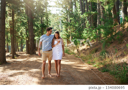 Couple take a walk in forest, nature and travel, relax together with hug outdoor, love with care and bonding. Summer, holiday with man and woman strolling in countryside with relationship and trust Couple take a walk in forest, nature and travel, relax together with hug outdoor, love with care and bonding. Summer, holiday with man and woman strolling in countryside with relationship and trust 134080695