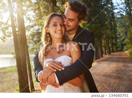 Wedding, love and couple hug in park, forest and nature for celebration of union, care and marriage commitment. Portrait of happy bride, groom and hugging in garden for romance, partner and happiness Wedding, love and couple hug in park, forest and nature for celebration of union, care and marriage commitment. Portrait of happy bride, groom and hugging in garden for romance, partner and happiness 134080701