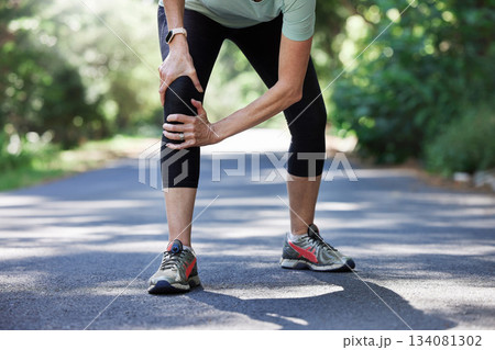 Running, knee pain and old woman with hand on leg in park for outdoor fitness and workout exercise. Health, wellness and muscle strain, senior runner with injury, hands on ache in support or relief. Running, knee pain and old woman with hand on leg in park for outdoor fitness and workout exercise. Health, wellness and muscle strain, senior runner with injury, hands on ache in support or relief. 134081302