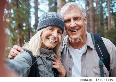 Old couple, selfie and hiking in forest, happy people in portrait, nature and memory for social media post. Smile in picture, adventure and fitness, man and woman with active retirement and outdoor Old couple, selfie and hiking in forest, happy people in portrait, nature and memory for social media post. Smile in picture, adventure and fitness, man and woman with active retirement and outdoor 134081449