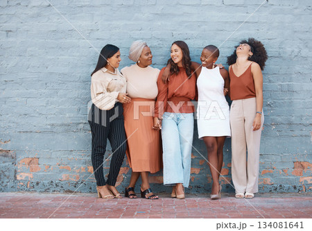 Laughing, diversity and a team of business black women outdoor on a blue brick wall for conversation. Talking, joking or bonding with a female employee and colleague group taking a break outside Laughing, diversity and a team of business black women outdoor on a blue brick wall for conversation. Talking, joking or bonding with a female employee and colleague group taking a break outside 134081641
