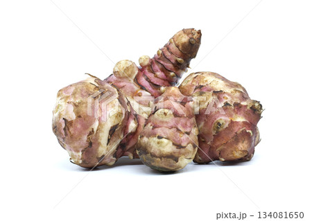 Fresh Jerusalem artichokes isolated on a white background, ready for cooking Fresh Jerusalem artichokes isolated on a white background, ready for cooking 134081650
