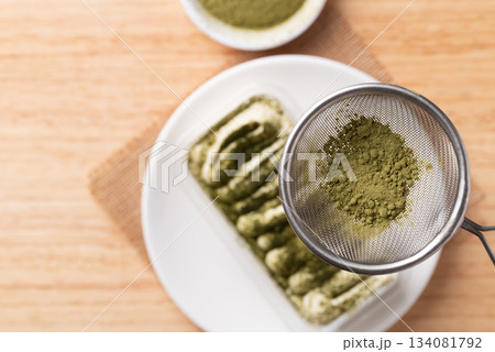 Matcha Tiramisu cake with green tea powder on top, Italian dessert fusion with Japanese Matcha Tiramisu cake with green tea powder on top, Italian dessert fusion with Japanese 134081792