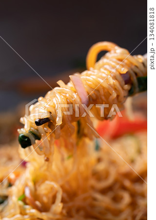 Japchae, Korean stir fried glass noodles with vegetables, pork, soy sauce and sesame seed Japchae, Korean stir fried glass noodles with vegetables, pork, soy sauce and sesame seed 134081818