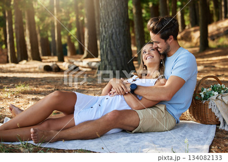 Couple on picnic, cuddle and happy relationship with love and trust, travel and adventure in nature park. Young people in forest, outdoor and happiness together with smile, commitment and care Couple on picnic, cuddle and happy relationship with love and trust, travel and adventure in nature park. Young people in forest, outdoor and happiness together with smile, commitment and care 134082133