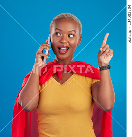 Woman, phone call and superhero for talk by background in studio for idea, happy or customer service. Young african girl, model and super hero cape with chat, consulting or communication for advice Woman, phone call and superhero for talk by background in studio for idea, happy or customer service. Young african girl, model and super hero cape with chat, consulting or communication for advice 134082204