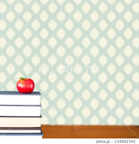 Red apple on pile of books 134082342