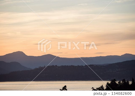 Scenic view of silhouette mountains by sea Scenic view of silhouette mountains by sea 134082600